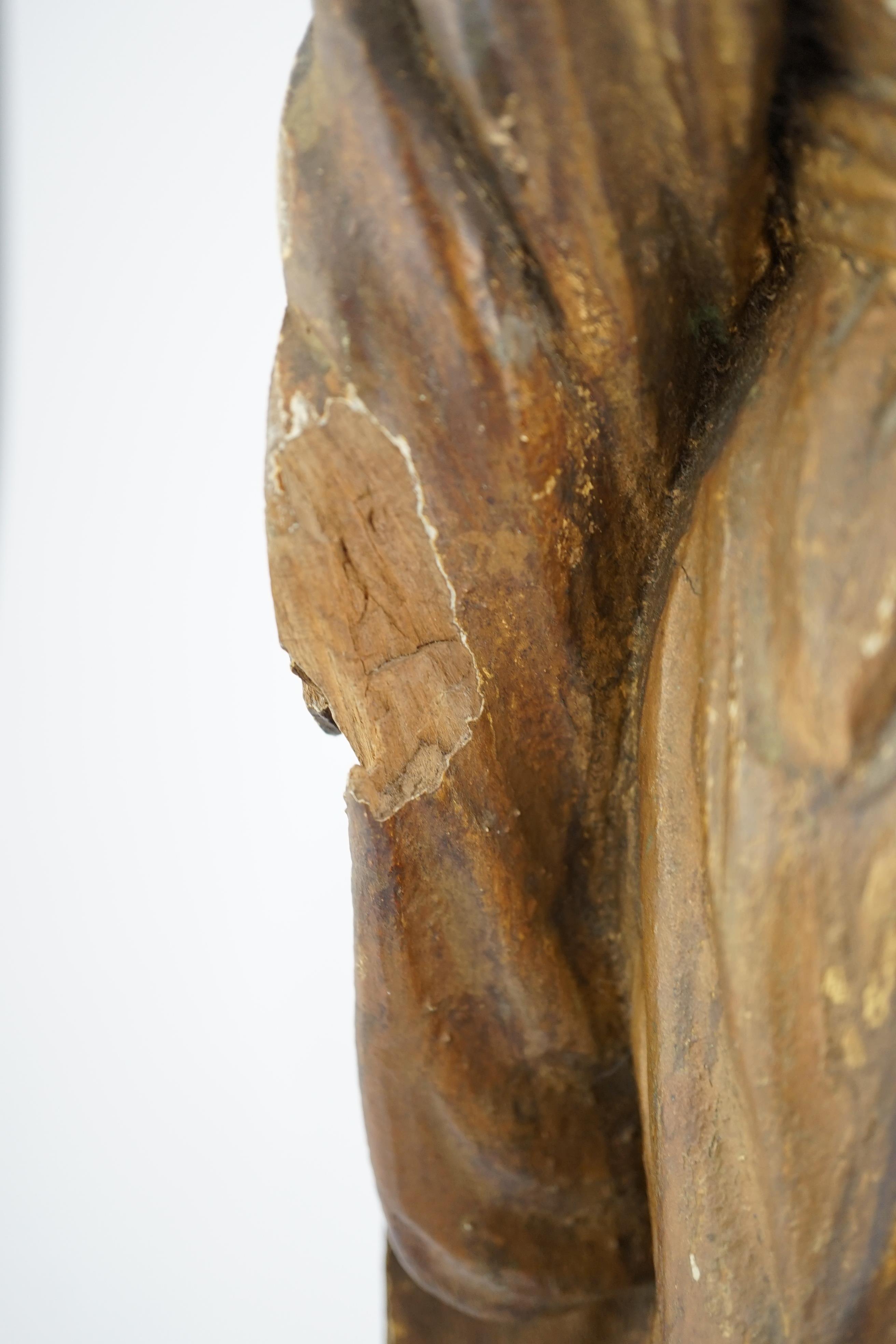 An 18th century Continental carved wood figure of a female saint
